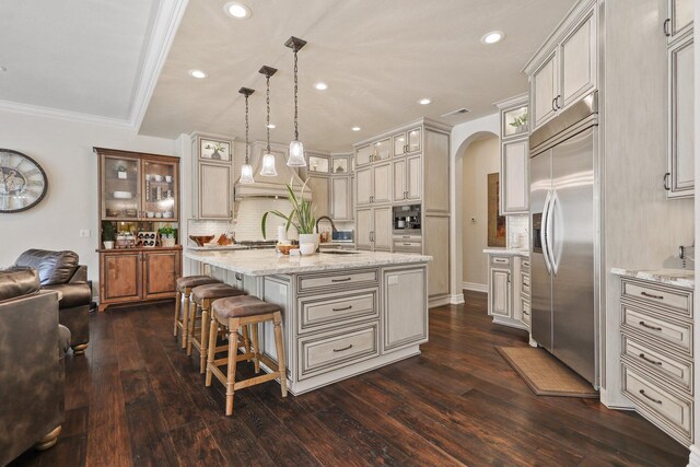 13194 Tierra Heights Rd, Redding, CA 96003 - kitchen featuring arched walkways, stainless steel built in fridge, glass insert cabinets, and dark wood-style floors