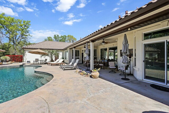 13194 Tierra Heights Rd, Redding, CA 96003 - view of swimming pool with outdoor dining area, a patio area, a fenced in pool, and a ceiling fan