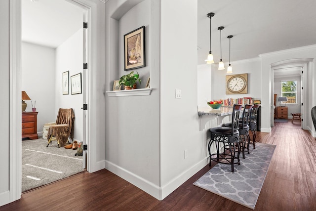 6180 Lucca Trl, Redding, CA 96003 - corridor with arched walkways, baseboards, crown molding, and dark wood finished floors