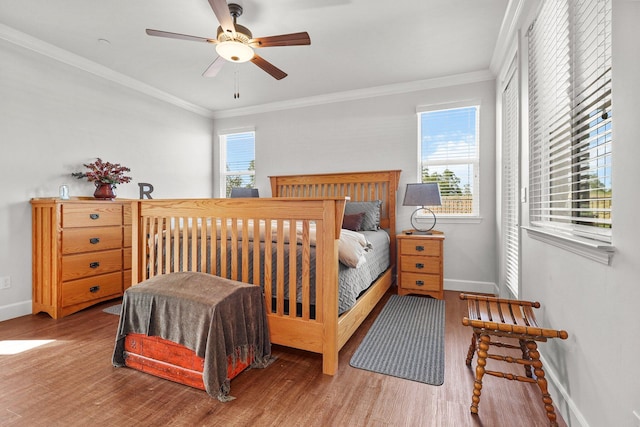 6180 Lucca Trl, Redding, CA 96003 - bedroom featuring crown molding, baseboards, and wood finished floors