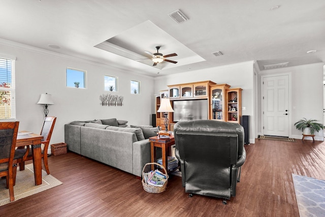 6180 Lucca Trl, Redding, CA 96003 - living area with dark wood-style flooring, visible vents, and crown molding