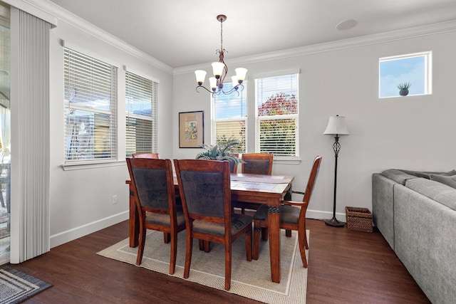 6180 Lucca Trl, Redding, CA 96003 - dining room with dark wood-type flooring, a notable chandelier, baseboards, and ornamental molding