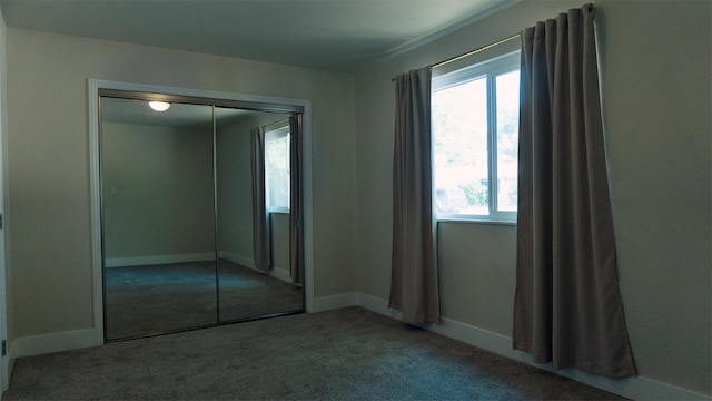 5080 Debbie Ln, Redding, CA 96002 - unfurnished bedroom featuring carpet floors, baseboards, and a closet