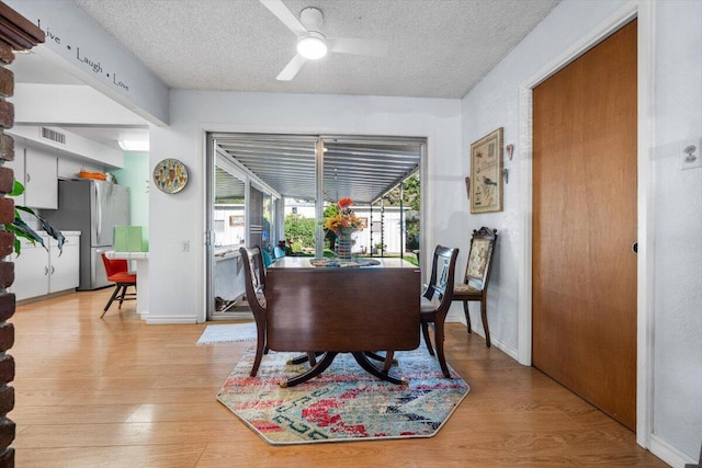 105 Kaer Ave, Red Bluff, CA 96080 - dining space featuring light wood-style flooring, a ceiling fan, baseboards, and a textured ceiling