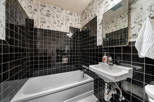 105 Kaer Ave, Red Bluff, CA 96080 - full bathroom featuring toilet, tile walls, bathing tub / shower combination, and wallpapered walls