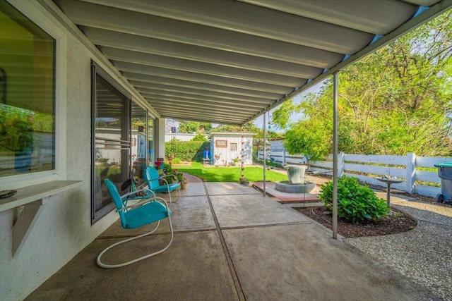 105 Kaer Ave, Red Bluff, CA 96080 - view of patio / terrace with fence, an outdoor structure, and a storage unit