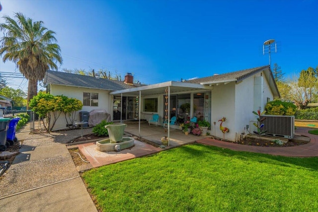 105 Kaer Ave, Red Bluff, CA 96080 - back of house with cooling unit, a yard, stucco siding, a patio, and fence