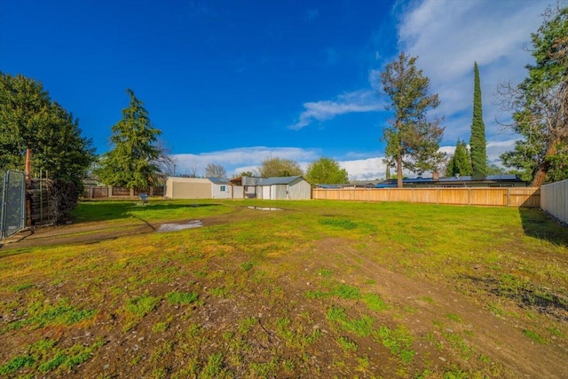 105 Kaer Ave, Red Bluff, CA 96080 - view of yard featuring an outbuilding and a fenced backyard