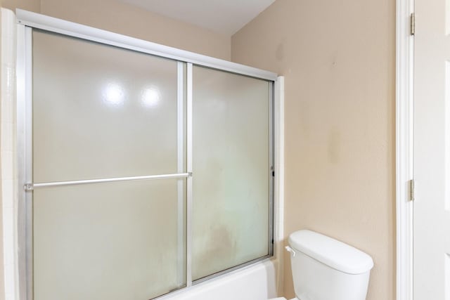 18170 Pine St, Lakehead, CA 96051 - bathroom featuring shower / bath combination with glass door and toilet