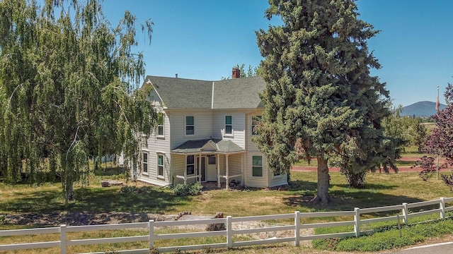 45517 Pittville Rd, Mcarthur, CA 96056 - view of front of house featuring a shingled roof, a chimney, a fenced front yard, and a front yard
