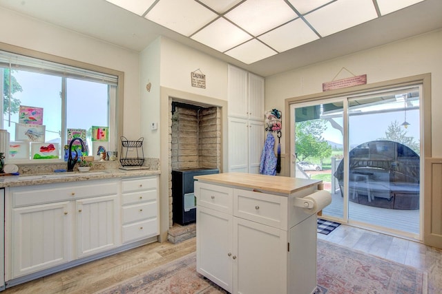 45517 Pittville Rd, Mcarthur, CA 96056 - kitchen with a sink, white cabinets, a wealth of natural light, and light wood-style flooring