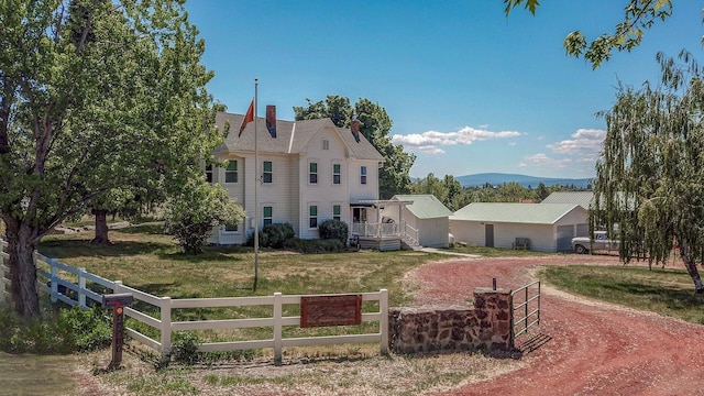 45517 Pittville Rd, Mcarthur, CA 96056 - victorian house featuring a front yard, dirt driveway, a mountain view, and a fenced front yard