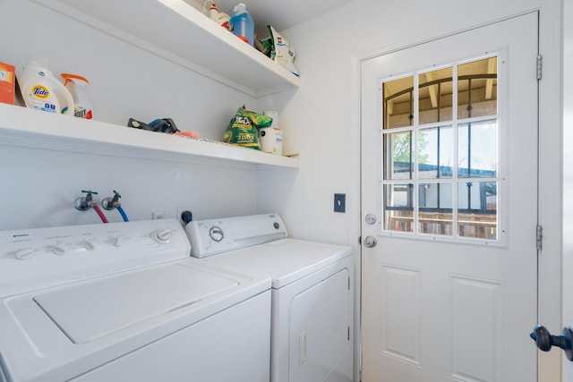 washroom featuring washer and clothes dryer and laundry area