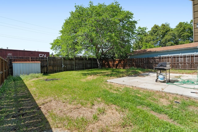 view of yard featuring a patio and a fenced backyard