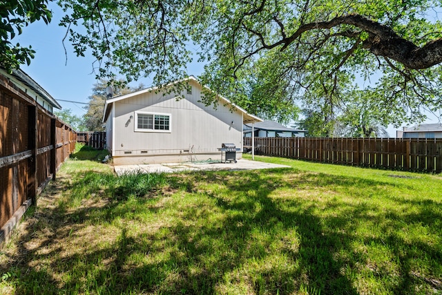 view of yard featuring a patio area and a fenced backyard