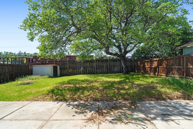 view of yard with a fenced backyard