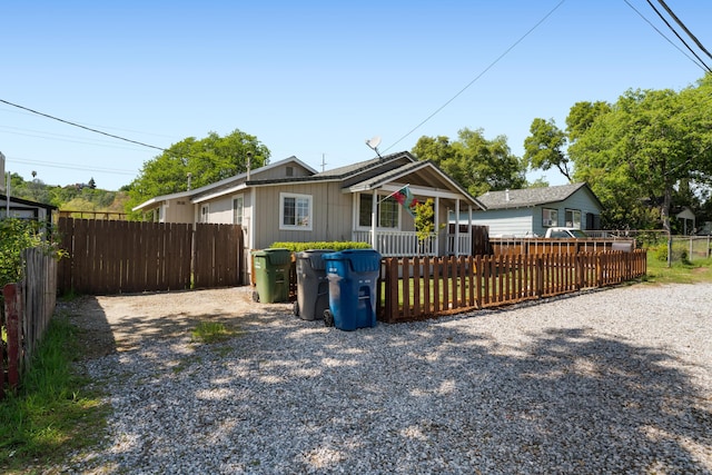 exterior space with driveway and fence