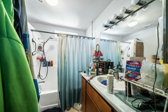 bathroom with shower / bath combo, visible vents, vanity, and a textured ceiling