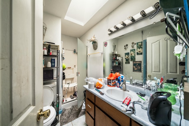 bathroom with tile patterned floors and vanity