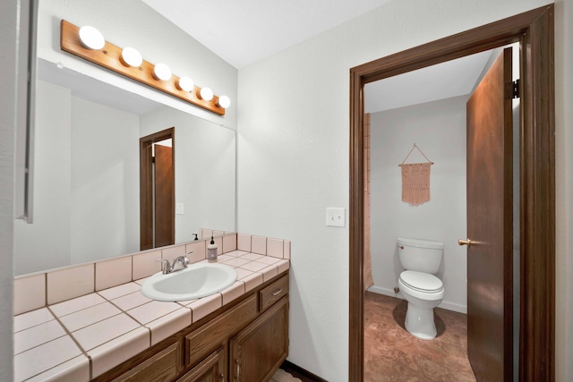 249 Ridgetop Dr Apt 239, Redding, CA 96003 - bathroom with vanity, toilet, and baseboards
