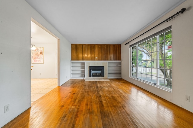 3082 Lawrence Rd, Redding, CA 96002 - unfurnished living room featuring a fireplace with flush hearth and wood-type flooring