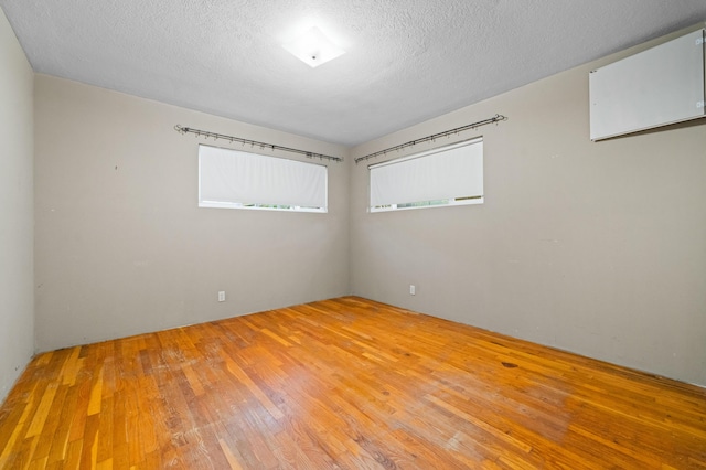 3082 Lawrence Rd, Redding, CA 96002 - spare room with hardwood / wood-style floors and a textured ceiling