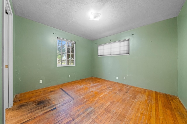 3082 Lawrence Rd, Redding, CA 96002 - spare room featuring hardwood / wood-style floors and a textured ceiling
