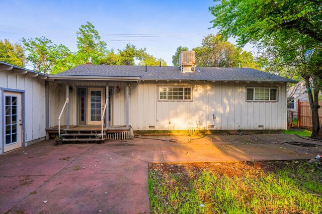 3082 Lawrence Rd, Redding, CA 96002 - back of property with a patio area, board and batten siding, and crawl space
