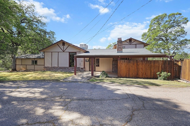 16588 Stanislaus Dr, Redding, CA 96001 - view of front of property featuring a chimney, a front yard, and fence