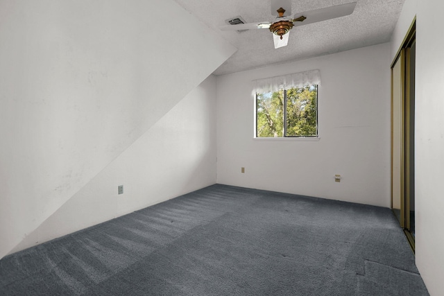 16588 Stanislaus Dr, Redding, CA 96001 - unfurnished bedroom with ceiling fan, carpet flooring, and a textured ceiling