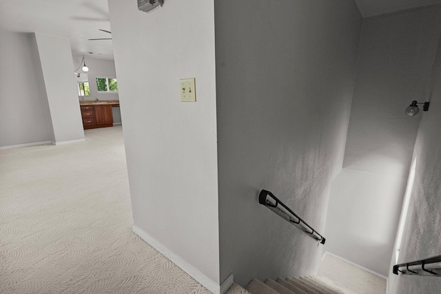 16588 Stanislaus Dr, Redding, CA 96001 - stairs with baseboards, a ceiling fan, and carpet
