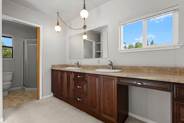 16588 Stanislaus Dr, Redding, CA 96001 - bathroom with toilet, double vanity, a sink, and plenty of natural light