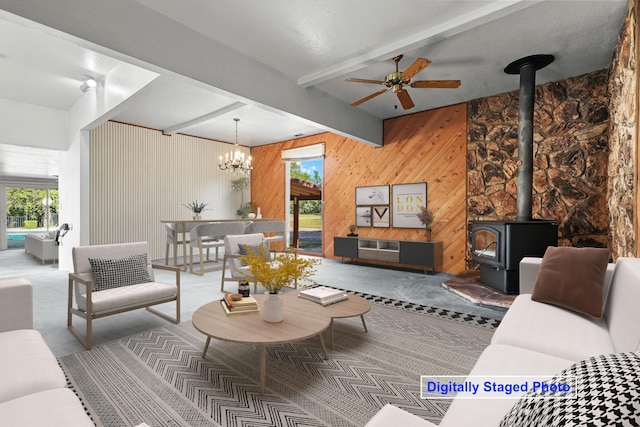 16588 Stanislaus Dr, Redding, CA 96001 - carpeted living area featuring wooden walls, beamed ceiling, a wood stove, and ceiling fan with notable chandelier