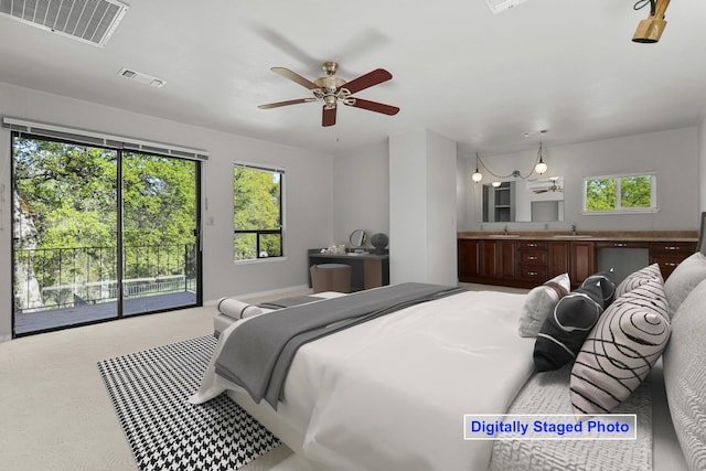 16588 Stanislaus Dr, Redding, CA 96001 - bedroom with access to exterior, carpet flooring, a sink, and visible vents