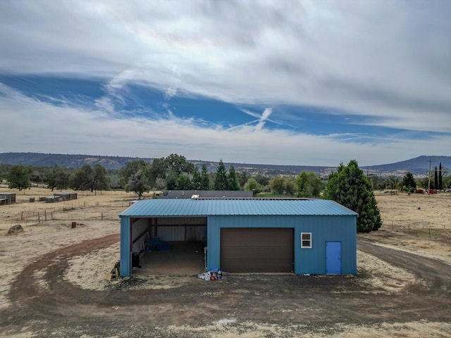 garage featuring a mountain view and a garage