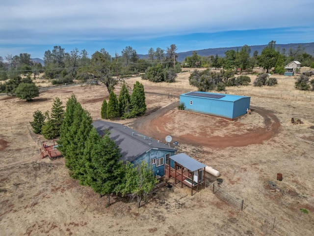 bird's eye view featuring a rural view and a mountain view