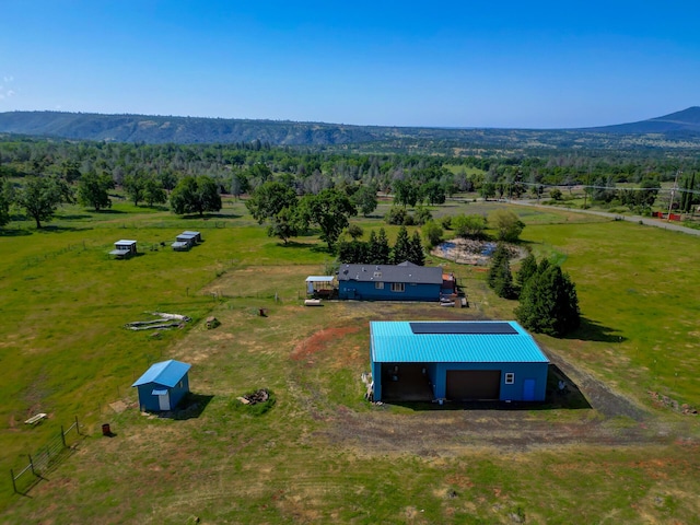birds eye view of property featuring a mountain view and a rural view