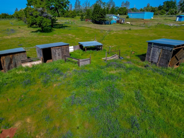 view of yard featuring fence and an outdoor structure