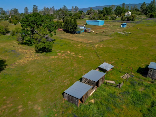 birds eye view of property with a rural view