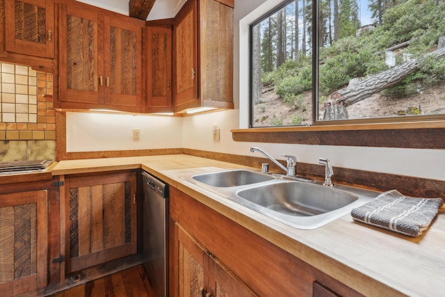 2120 Pack Trl, Mount Shasta, CA 96067 - kitchen featuring tasteful backsplash, light countertops, brown cabinetry, stainless steel dishwasher, and a sink