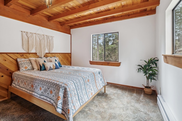 2120 Pack Trl, Mount Shasta, CA 96067 - carpeted bedroom with a baseboard heating unit, beam ceiling, and wood ceiling