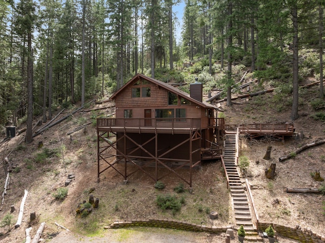 2120 Pack Trl, Mount Shasta, CA 96067 - rear view of property featuring stairway, a wooden deck, and a chimney