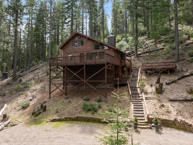 2120 Pack Trl, Mount Shasta, CA 96067 - back of house with stairs, a deck, and a chimney