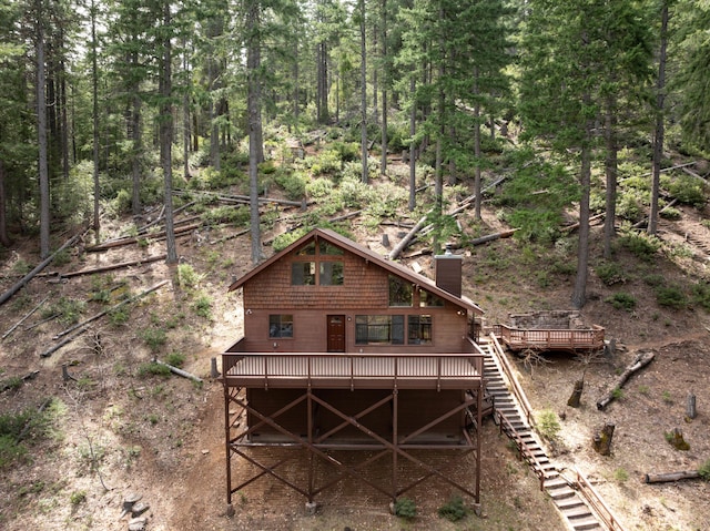 2120 Pack Trl, Mount Shasta, CA 96067 - rear view of property featuring a wooden deck, stairs, and a chimney