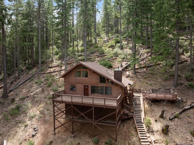 2120 Pack Trl, Mount Shasta, CA 96067 - back of house with a wooden deck, stairs, and a chimney