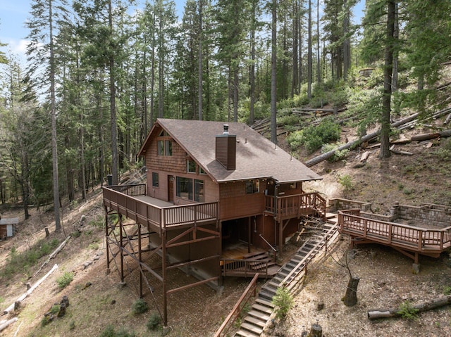 2120 Pack Trl, Mount Shasta, CA 96067 - rear view of house with a chimney, a shingled roof, a deck, and stairs