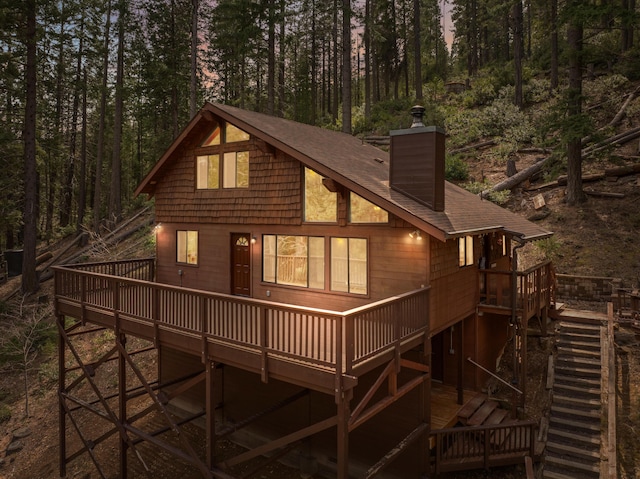 2120 Pack Trl, Mount Shasta, CA 96067 - back of house featuring roof with shingles, a wooden deck, stairway, and a chimney