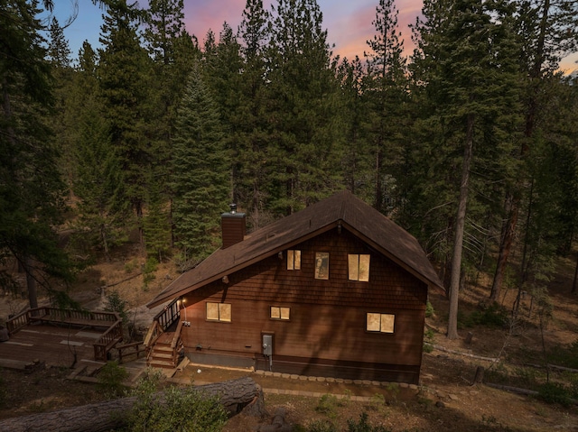 2120 Pack Trl, Mount Shasta, CA 96067 - property exterior at dusk with a view of trees and a chimney