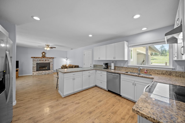 20035 Old Alturas Rd, Redding, CA 96003 - kitchen with light wood-style floors, open floor plan, ceiling fan, a sink, and appliances with stainless steel finishes