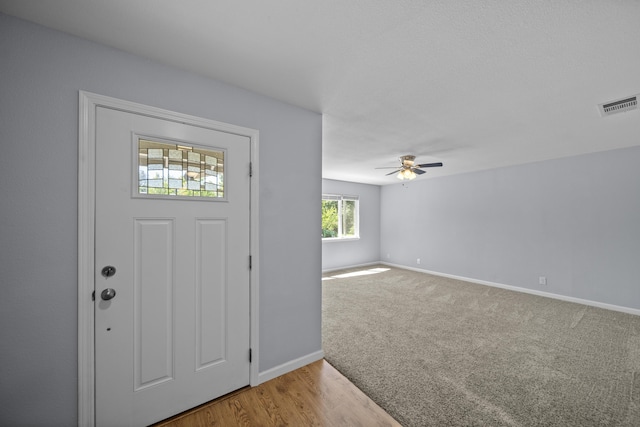 20035 Old Alturas Rd, Redding, CA 96003 - entryway with visible vents, a ceiling fan, baseboards, and light wood finished floors